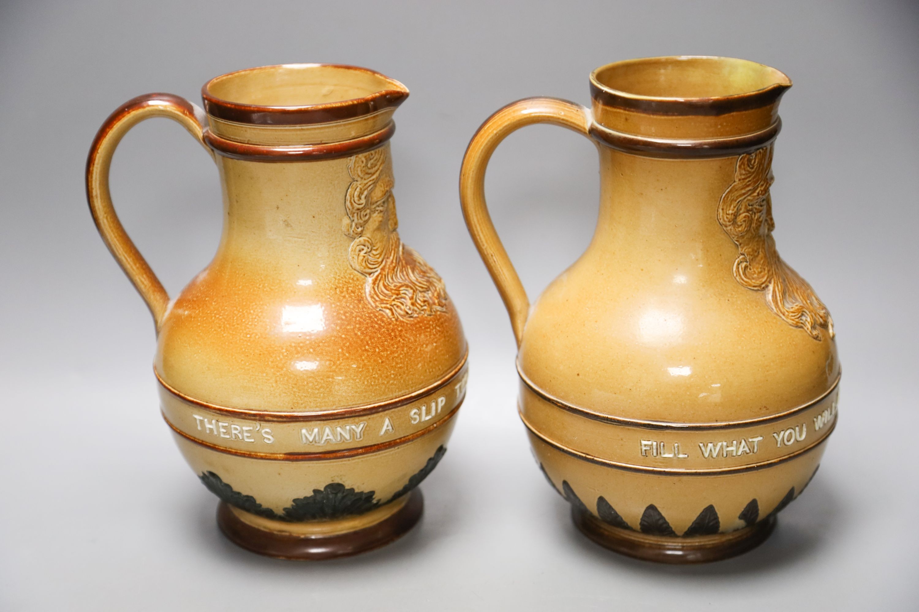 Two Doulton Lambeth salt-glazed stoneware Bellarmines with mottos, 21.5cm